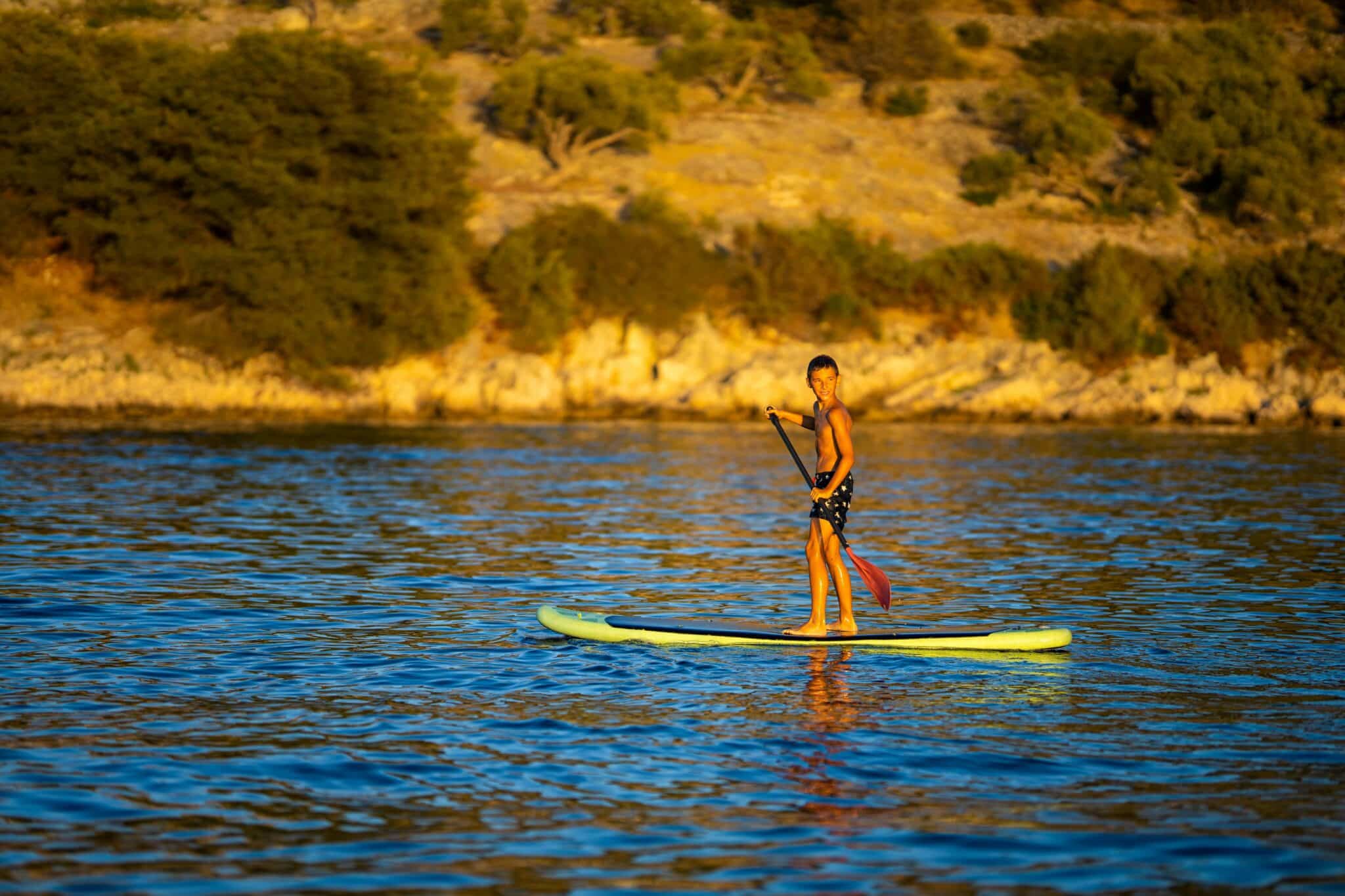 kid on a paddleboard